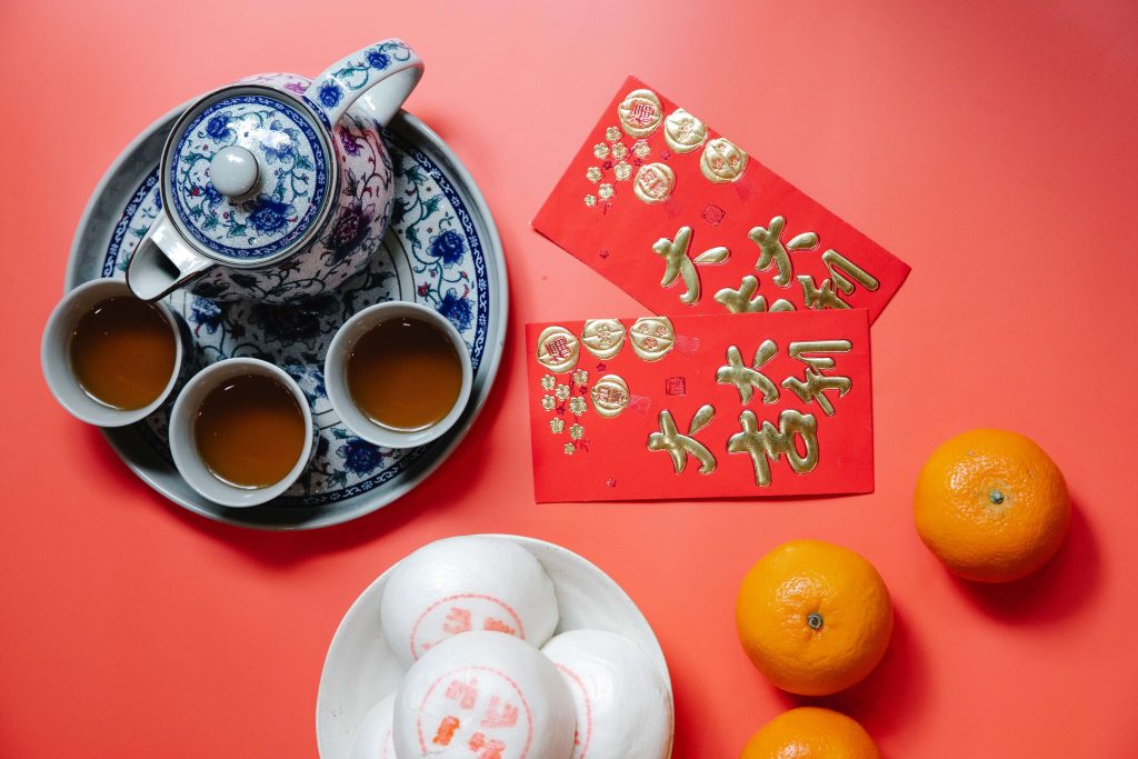 Snacks and Red Envelopes on a Red Background